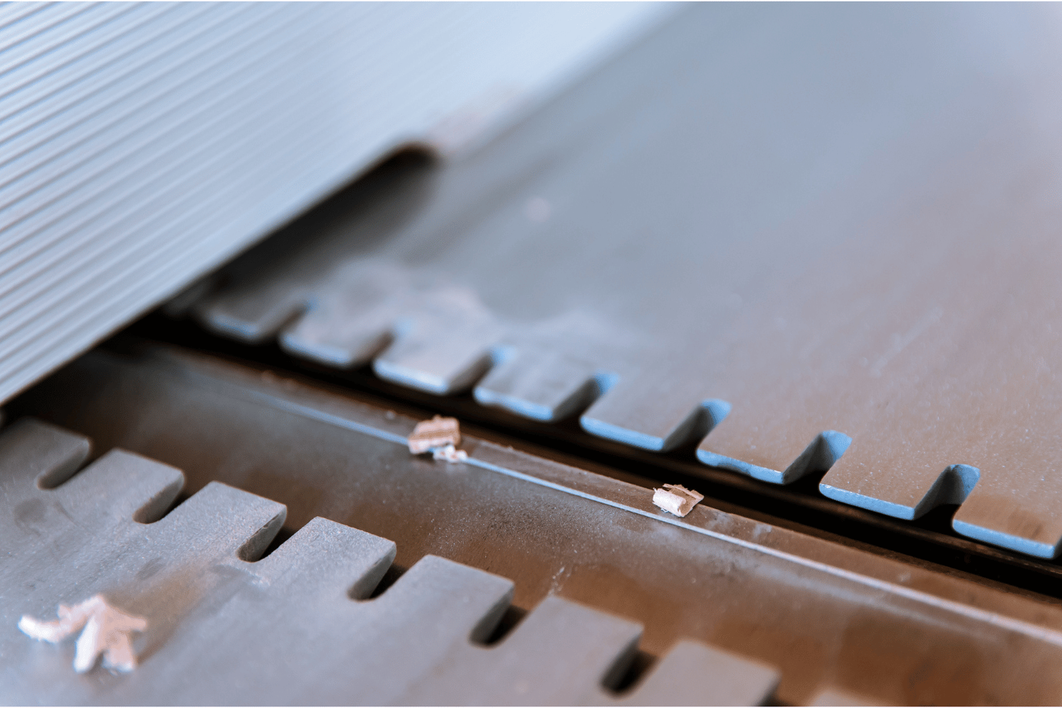 Jointer vs Planer - A close-up of a jointer's cutter head and infeed table