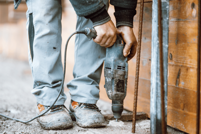 Hammer Drill Drilling through Concrete