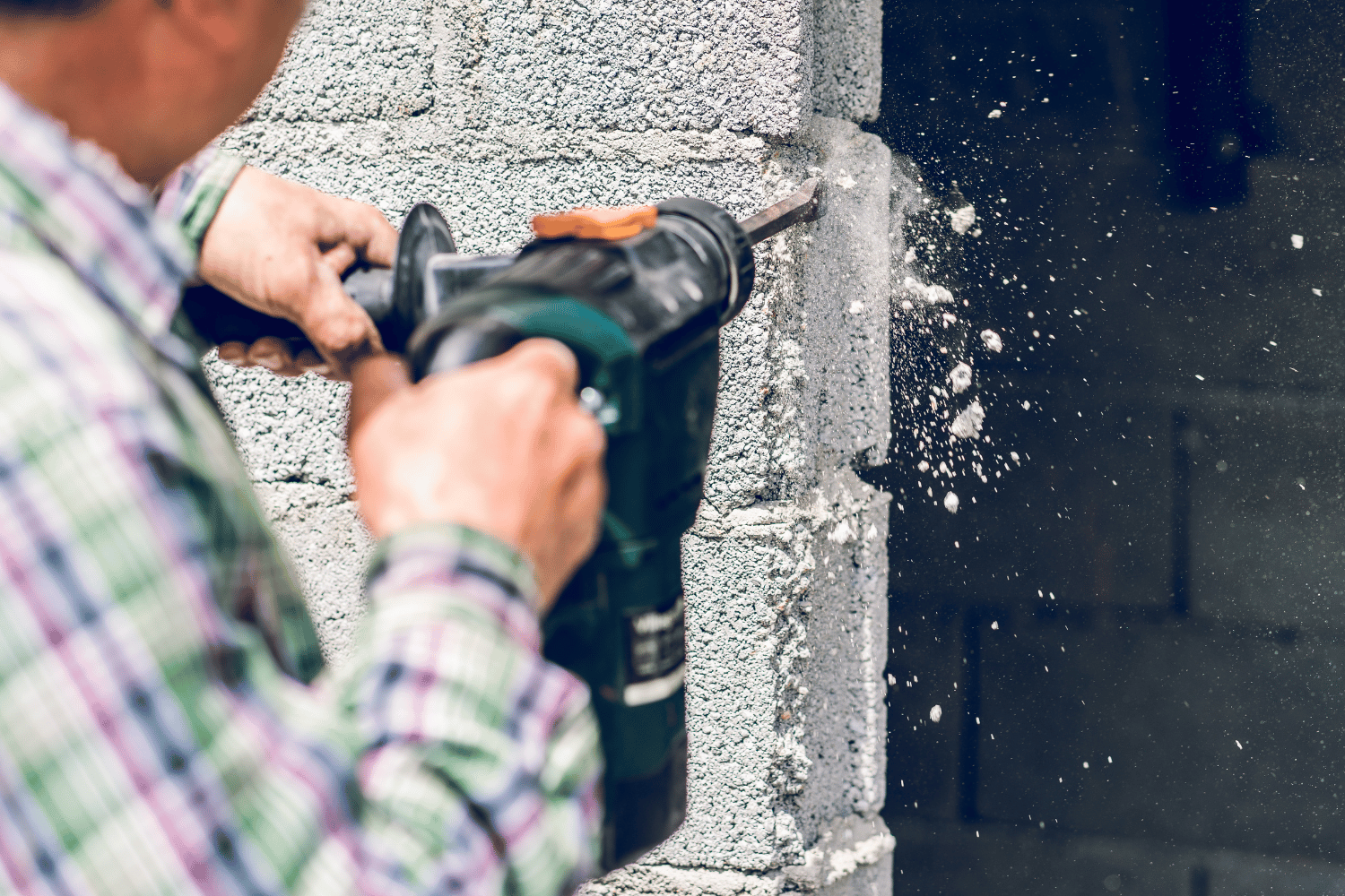 Hammer Drill Chipping Concrete Block