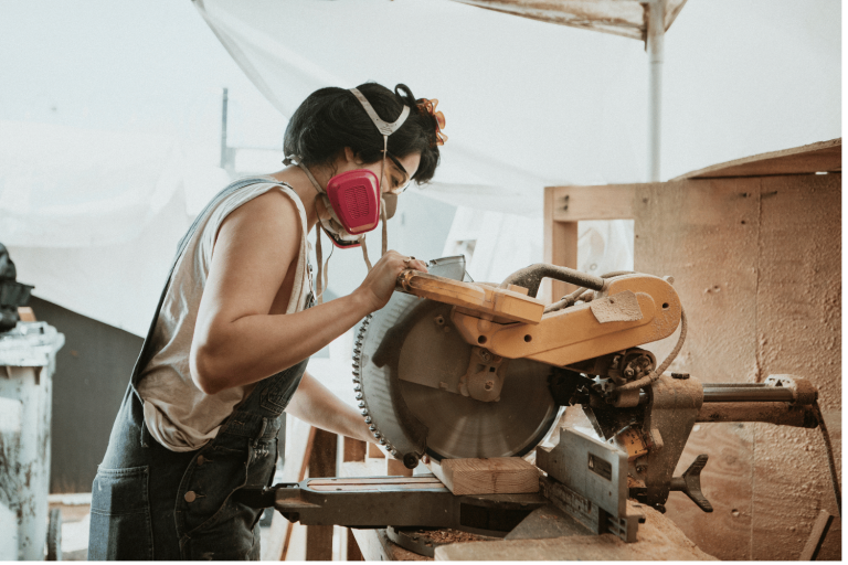 Miter Saw in use to cut wood