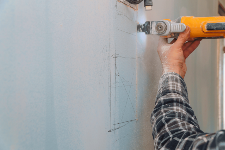 One of the uses of an oscillating multi tool - Plunge cutting drywall