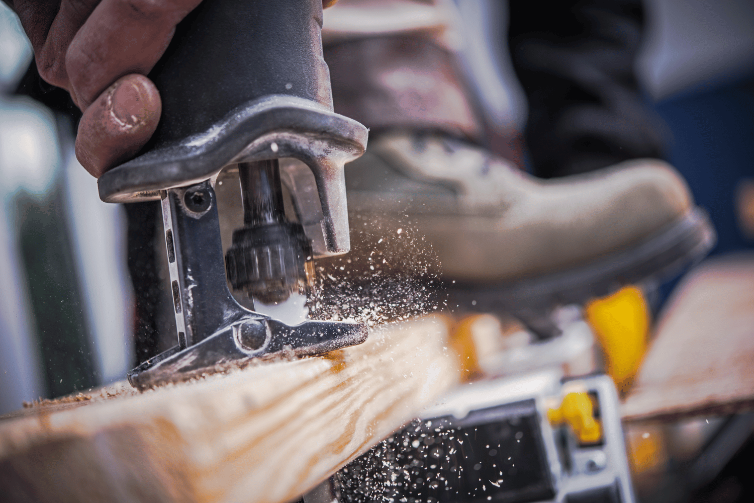 Reciprocating saw cutting wood